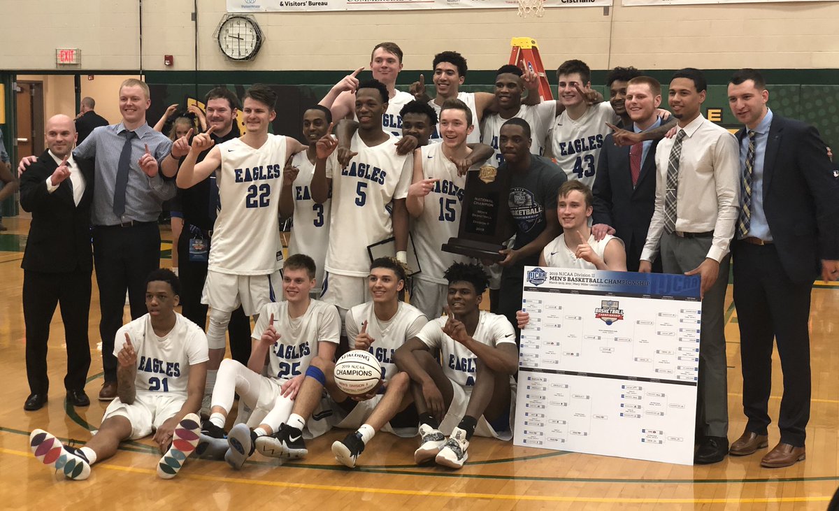 The Kirkwood men's basketball team and staff are all smiles minutes after winning the NJCAA Division II national championship, defeating Johnson County Community College, 64-58, Saturday night in Danville, Ill.