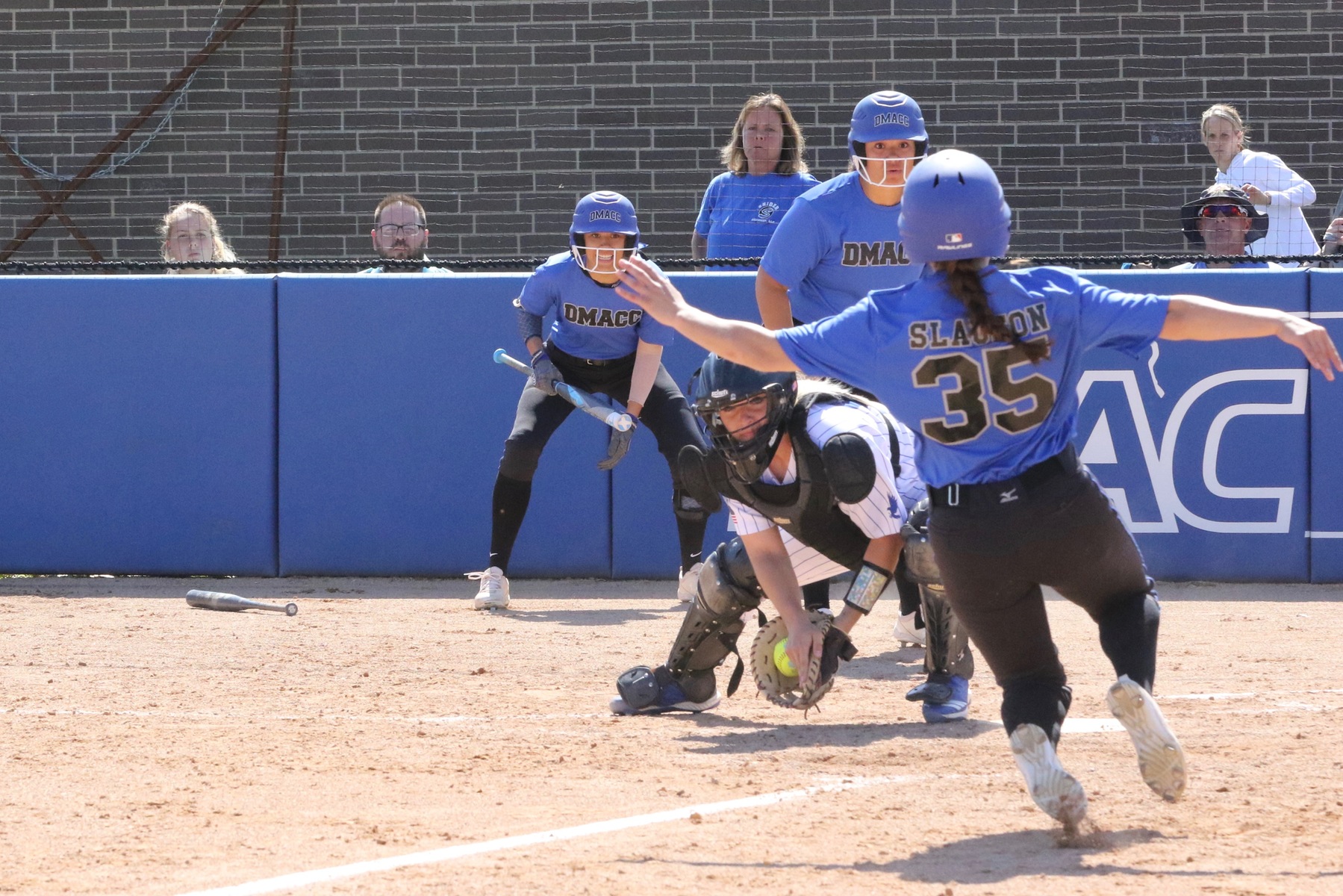 Kirkwood catcher Jessi Butler prepares to tag a DMACC runner at the plate during Wednesday's doubleheader at Kirkwood. (MSR photo by Margaret O'Banion)