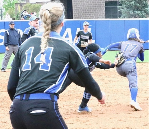 Kaitlyn Carlson of NIACC is tagged by Kirkwood third baseman London  Jackson after Carlson got caught in a rundown during Saturday's regional softball game at Kirkwood. Number 14 for Kirkwood is Lauren  Kuch. (MSR photo by Margaret O'Banion)